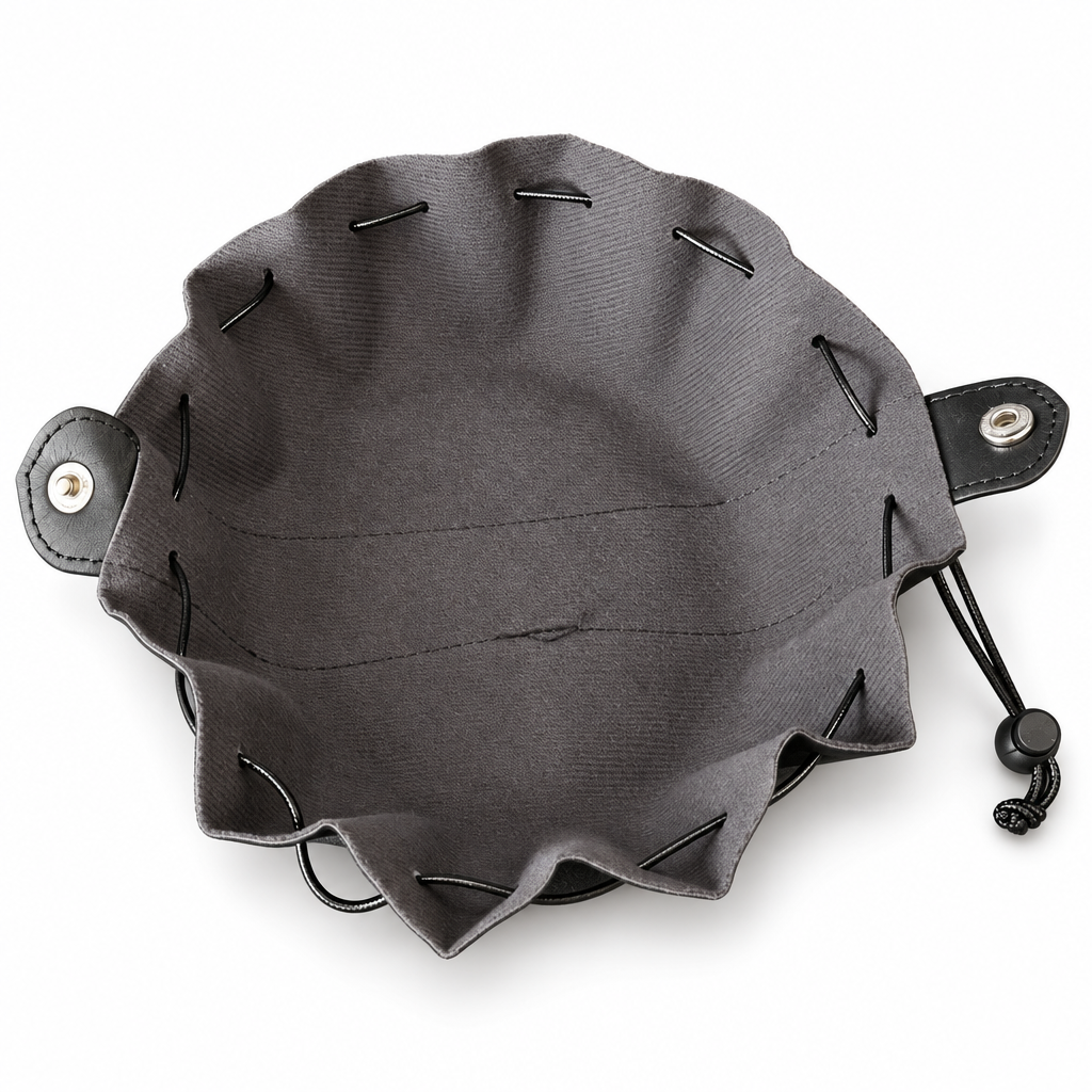 Black dice bag opened flat into a rolling tray