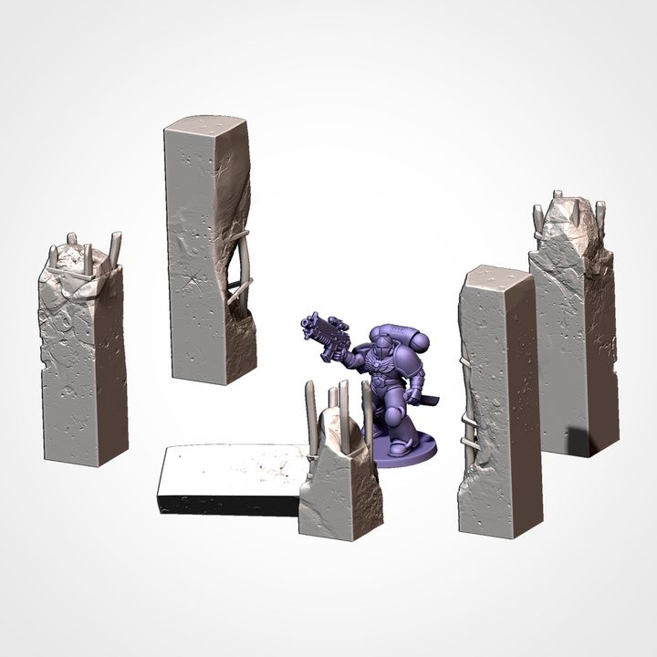 Tall wall segments and pillars, shown beside a 32mm miniature for scale